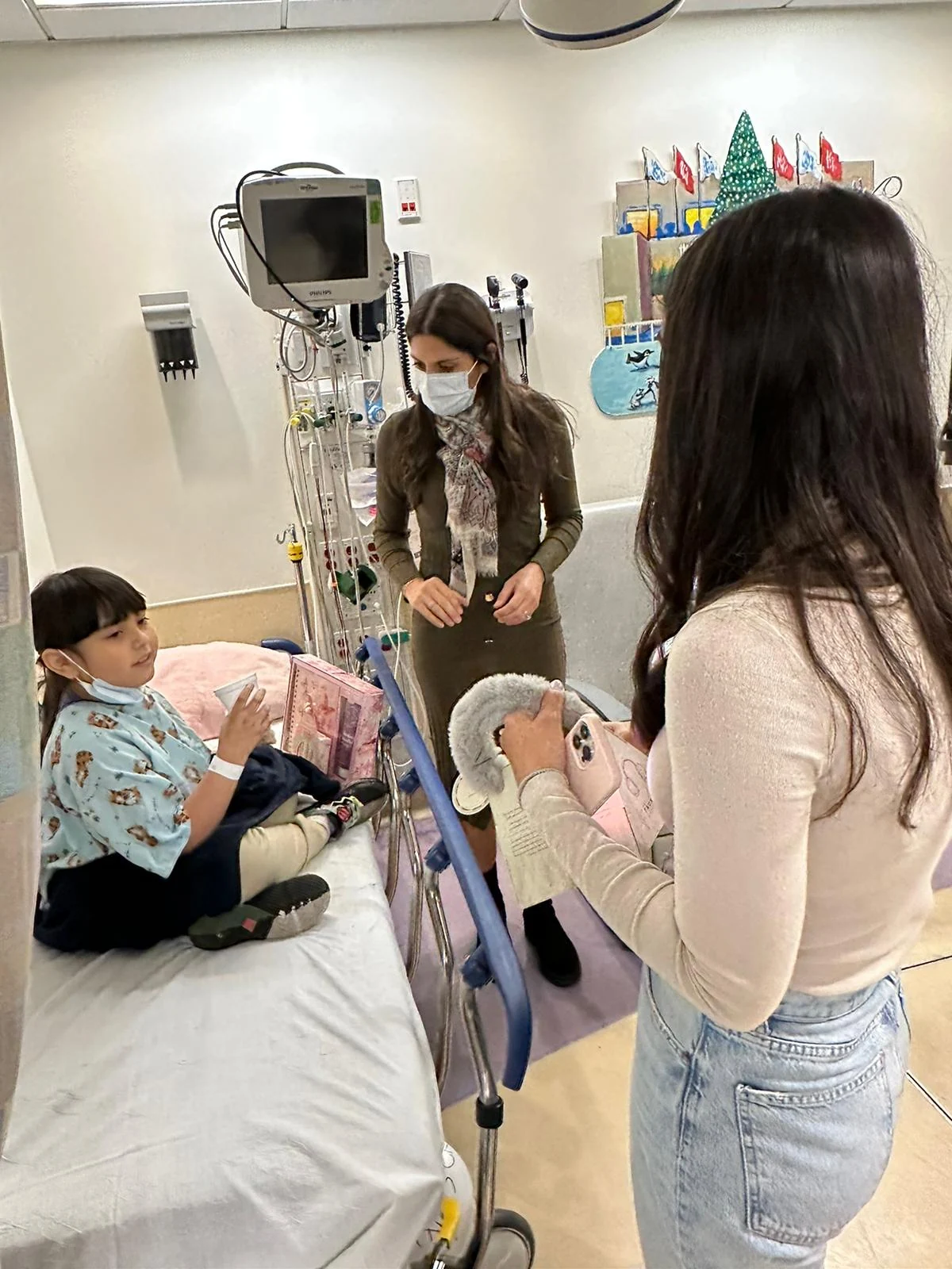 Volunteers sharing gifts during a hospital visit