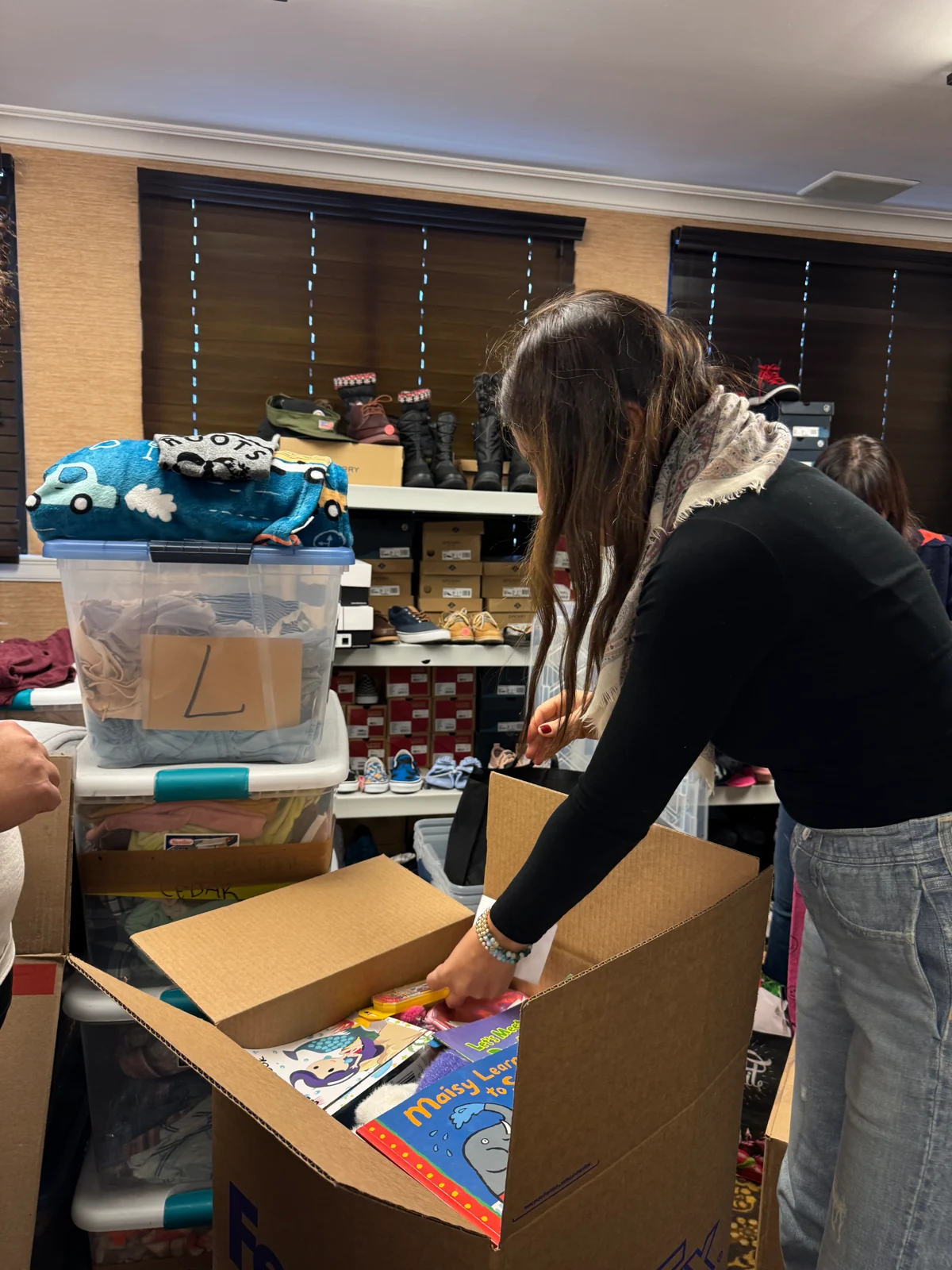 A volunteer packing supplies for families affected by the Los Angeles wildfires