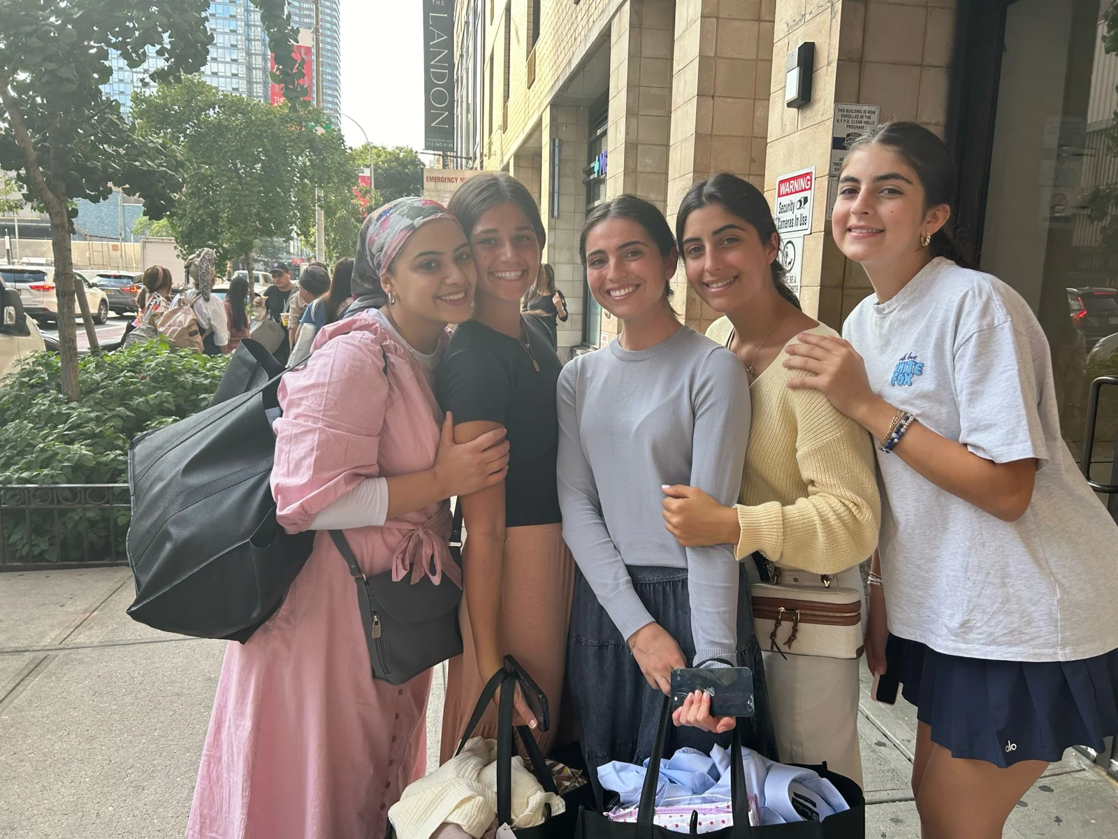 Participants together outside with shopping bags